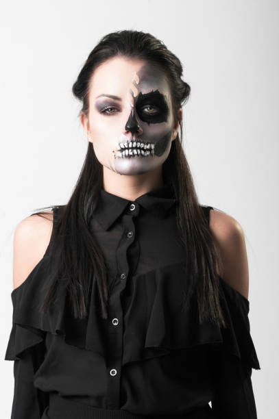 istock Beautiful woman with make-up skeleton 985890266