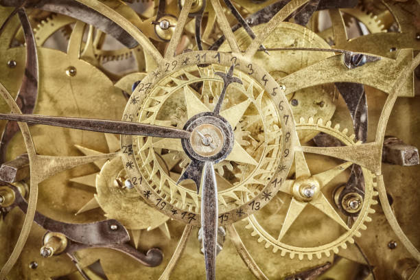 istock Innerworks of an antique clock with gear wheels 985890738