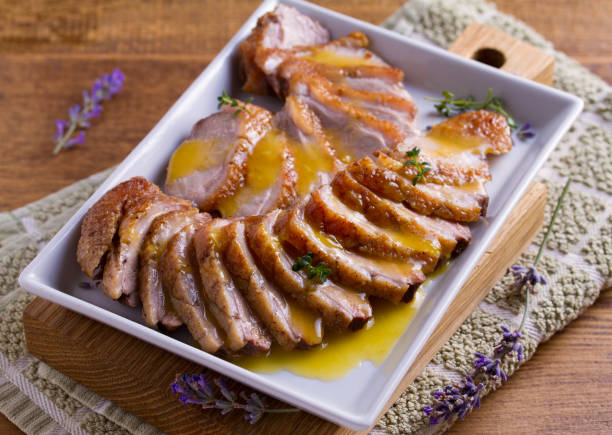 istock Sliced duck breast with orange sauce and thyme 985904188