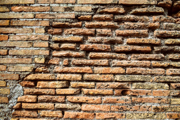 istock Ancient Roman brickwork. Bricks, Roman concrete, Rome. Background 985905374