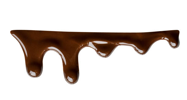 istock Melted chocolate dripping isolated on white background. Clipping path 985909436