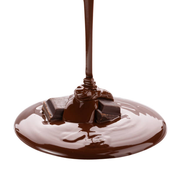 istock Melted chocolate flowing. Isolated on white background with clipping path 985909466