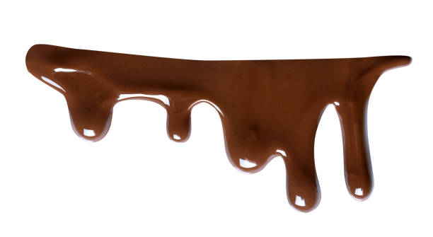 istock Melting chocolate drips. Chocolate isolated on white background. 985909494