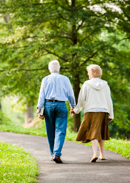 istock Senior couple holding hands 985909528