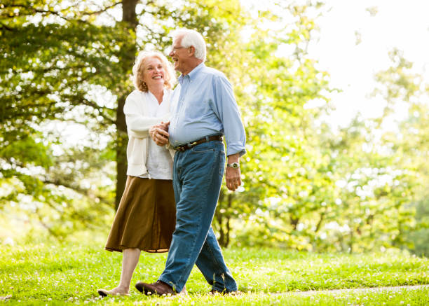 istock Senior couple holding hands 985909636
