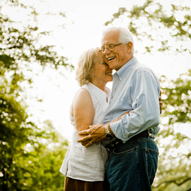 istock Senior couple holding hands 985909700