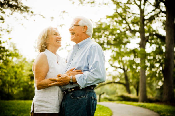 istock Senior couple holding hands 985909712
