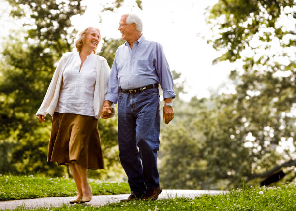 istock Senior couple holding hands 985909716