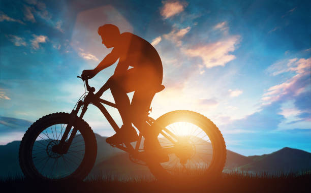 istock Biker riding his bicycle in the mountains. 985909776
