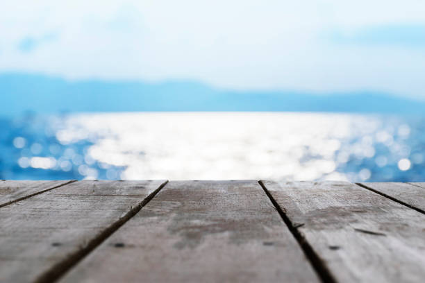 The front is a wooden floor. Blue background.A beautiful bokeh is eye-catching.Natural colors look attractive.Reflections on sea surface