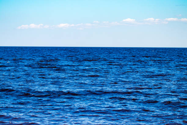 istock blue sea and sky background - view over 985914978