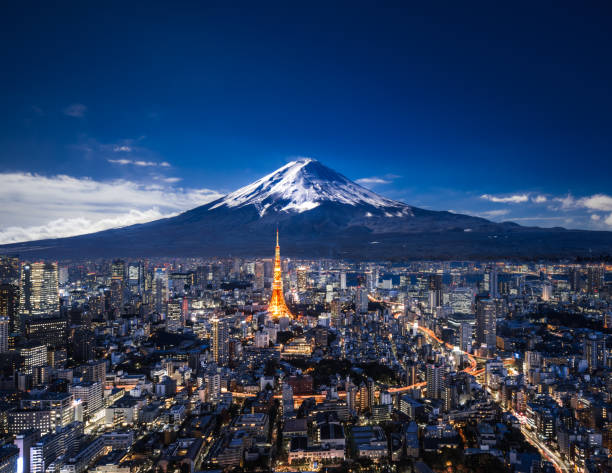 Mt. Fuji and Tokyo skyline at night Elevated view of Mt. Fuji and modern skyscrapers in Tokyo at night. mt. fuji photos stock pictures, royalty-free photos & images