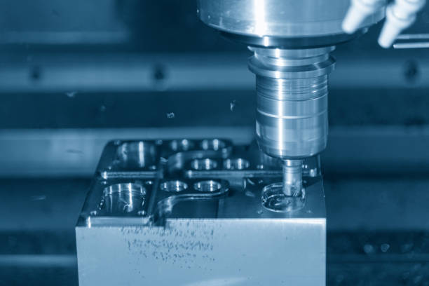 istock The CNC milling machine cutting the mold part in roughing   process 985941200