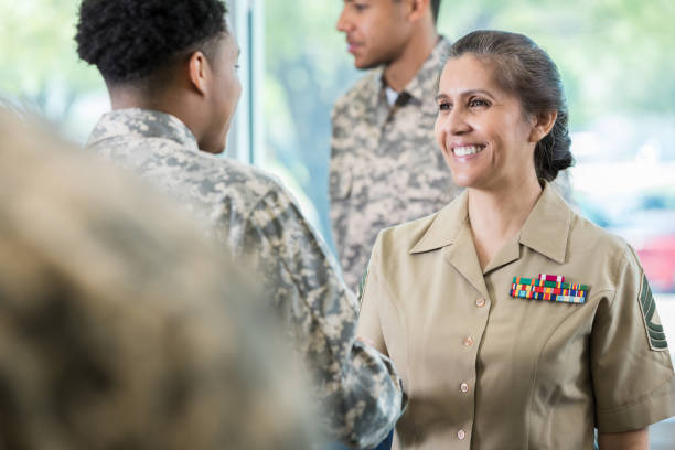 Military officer greeting new recruit