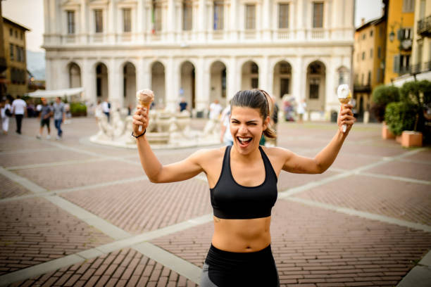 istock Sporty woman with ice creams. 985950672