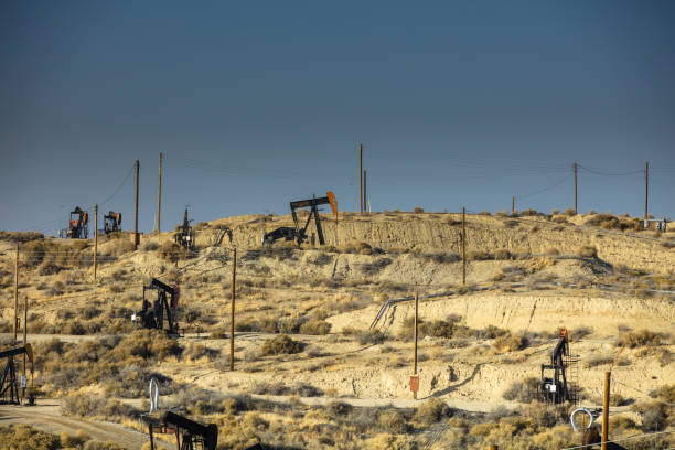 istock Oil Pumps on Barren Hillside 985959498