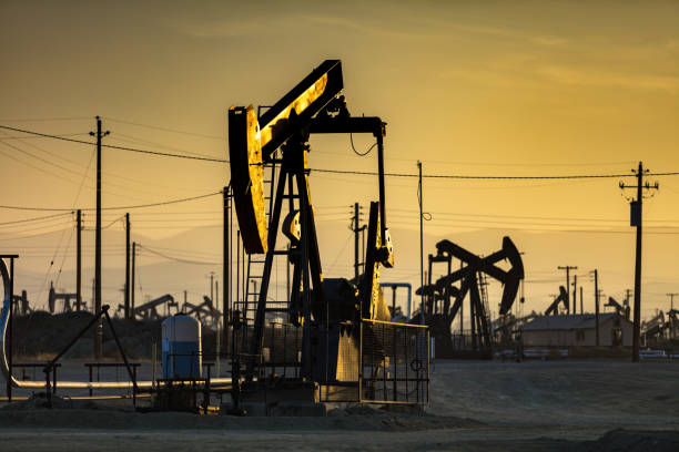 istock Last Light on Shadowy Oil Field 985959586