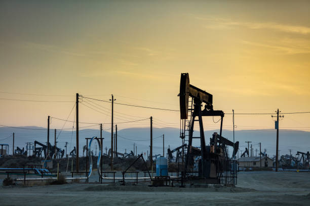 istock Hazy Sunset on Oil Field 985959598