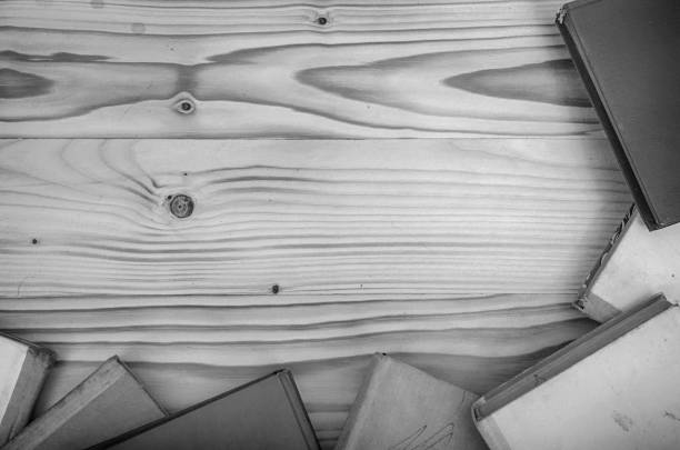 istock Old books on a wooden table. 985960208