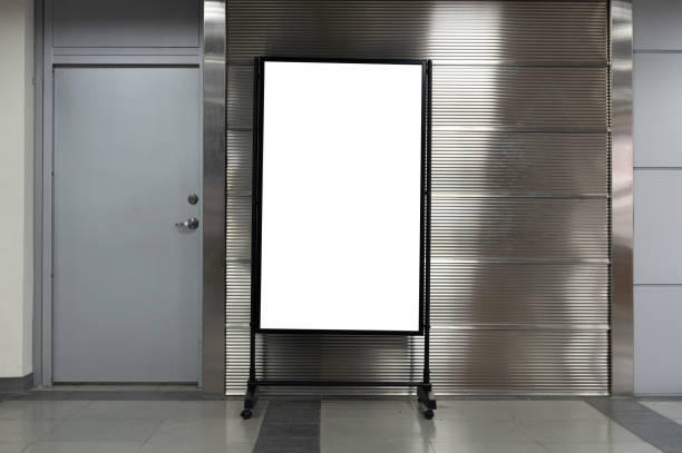 istock Large blank billboard on a street wall, banners with room to add your own text 985966310