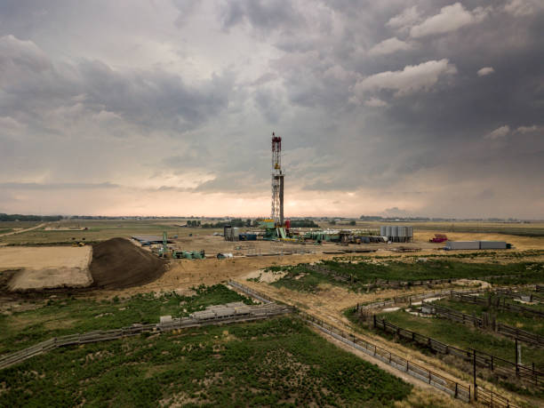 istock Fracking Drilling Rig in Front of a Dramatic Sky at Dusk 985978062