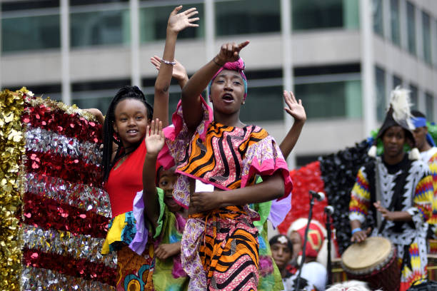 Philadelphia, PA, USA - June 23, 2018; Children on a float wave to the crowd during the annual Juneteenth parade in Center City Philadelphia, PA, on June 23, 2018. The Juneteenth Independence Day or Freedom Day commemorates the announcement of abolition of slavery on June 19, 1865.