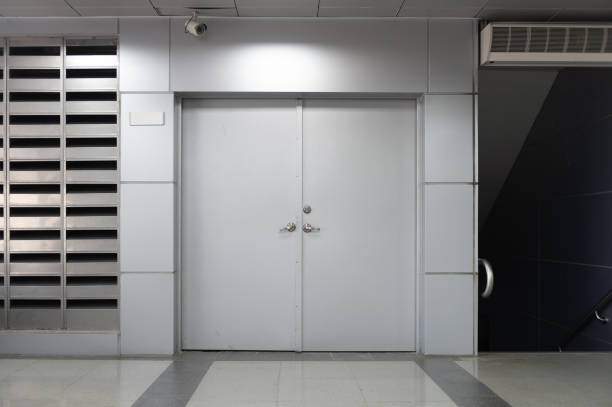 istock sidewalk by street wall & door 985981156