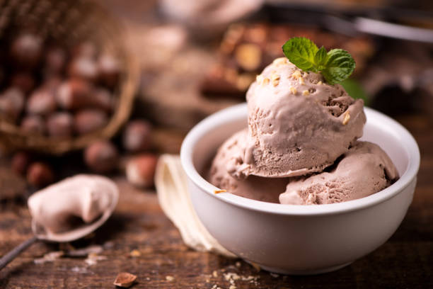 istock Fresh hazelnuts ice cream on wooden table. 985998828