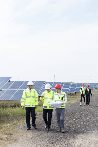 istock Engineers discuss the survey at the green energy base 985998862