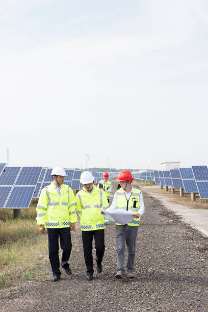 istock Engineers discuss the survey at the green energy base 985998998