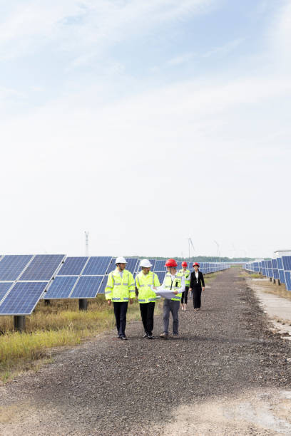 istock Engineers discuss the survey at the green energy base 985999006