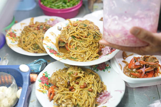 istock Mie Kepiting Aceh, Fired Seafood curry with crab and Noodle 985999308