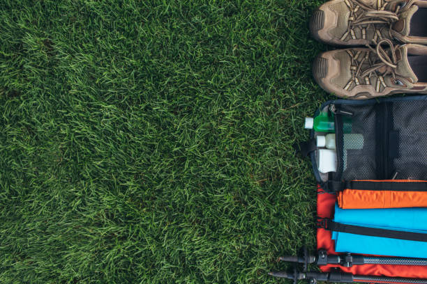 istock flat lay of hiking stuff on on the green grass 986010450