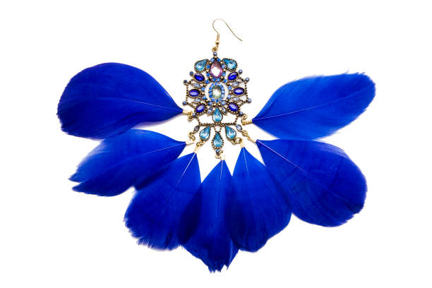 istock Earrings with blue feathers isolated on white 986020446