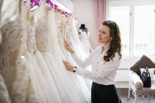 istock Gorgeous bride to be picking up a wedding dress 986023490