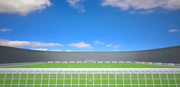 3d rendering of a soccer field against a blue sky on top. A soccer ball is placed on the penalty shot.