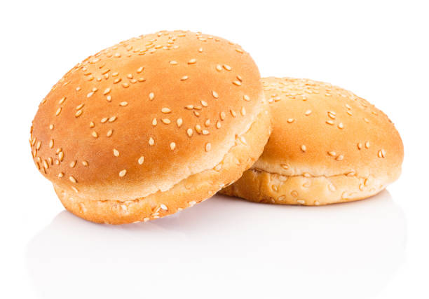 istock Two hamburger buns with sesame isolated on white background 986035622