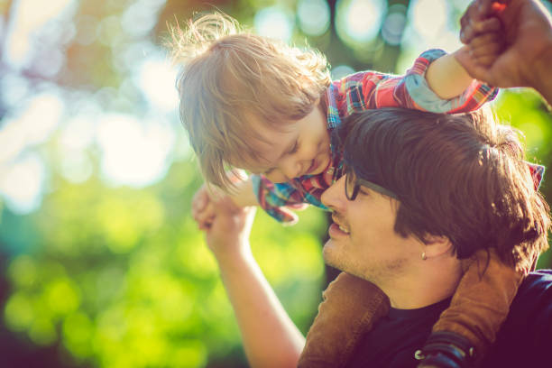 istock Family enjoying summer in park 986036090