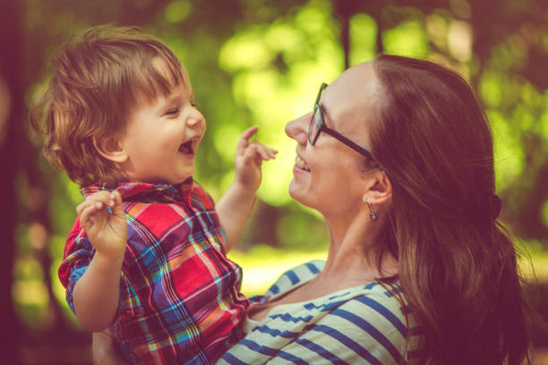 istock Family enjoying summer in park 986036666