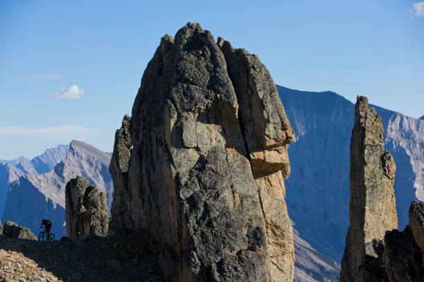 A man goes for a cross-country mountain bike ride in the Rocky Mountains of Canada.