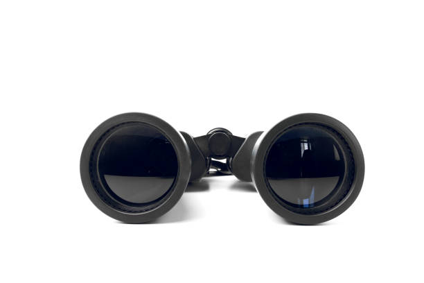 Close Up Of Black Binoculars With Big Reflective Lenses On Plain White Background Black Binoculars With Big Reflective Lenses On Plain White Background telescope lens stock pictures, royalty-free photos & images