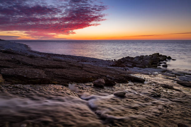 istock River running out on the cliffs by the sea 986055094