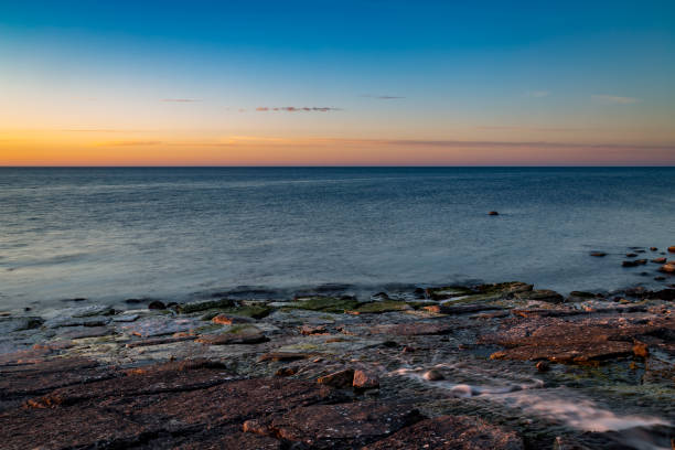 istock River running out on the cliffs by the sea 986055196