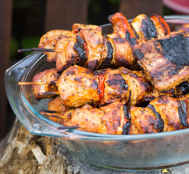 istock Barbeque. Skewers of meat with vegetables 986063476