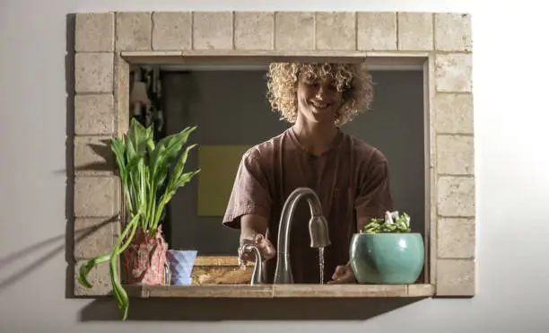 Teenager getting drink of water