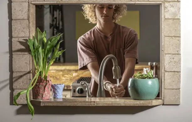 Teenager washing hands