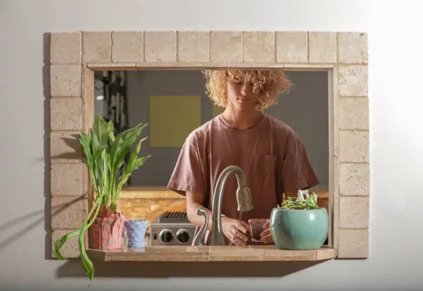 Teenager getting drink of water