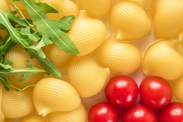 istock Food background Uncooked Macaroni Lumaconi 986086508