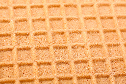 Brown wafer textured surface closeup background