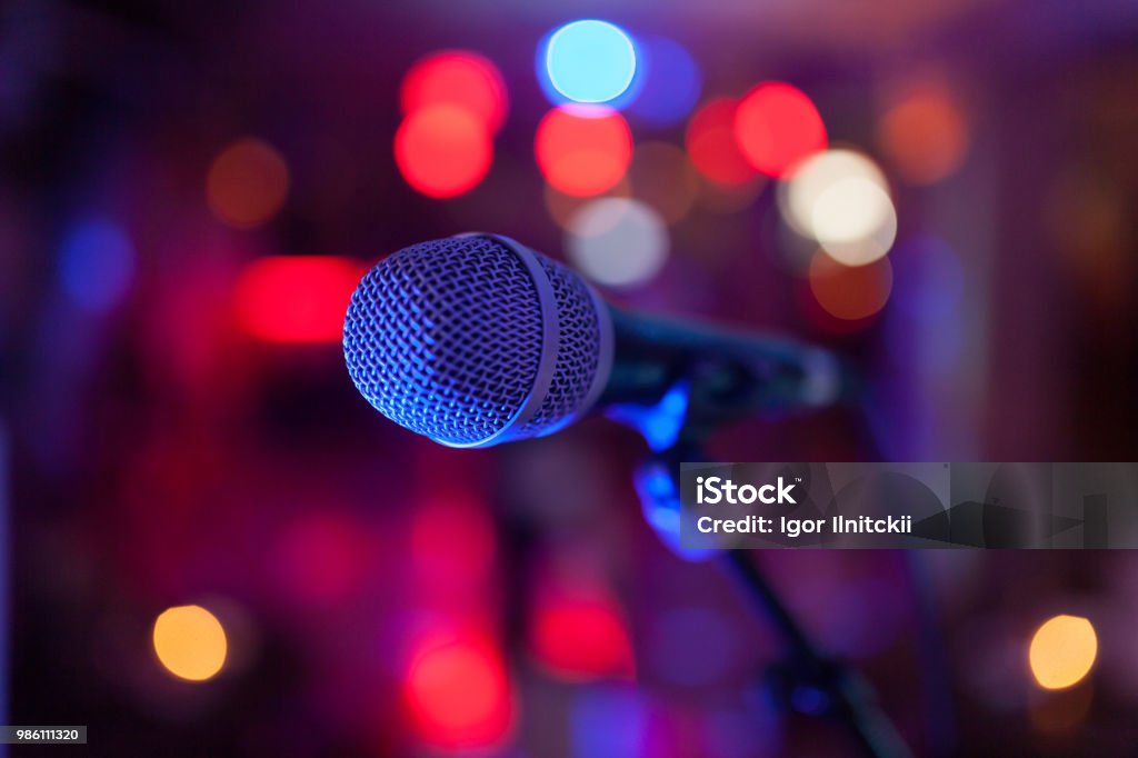 Image of a microphone in the concert hall. Microphone Stock Photo
